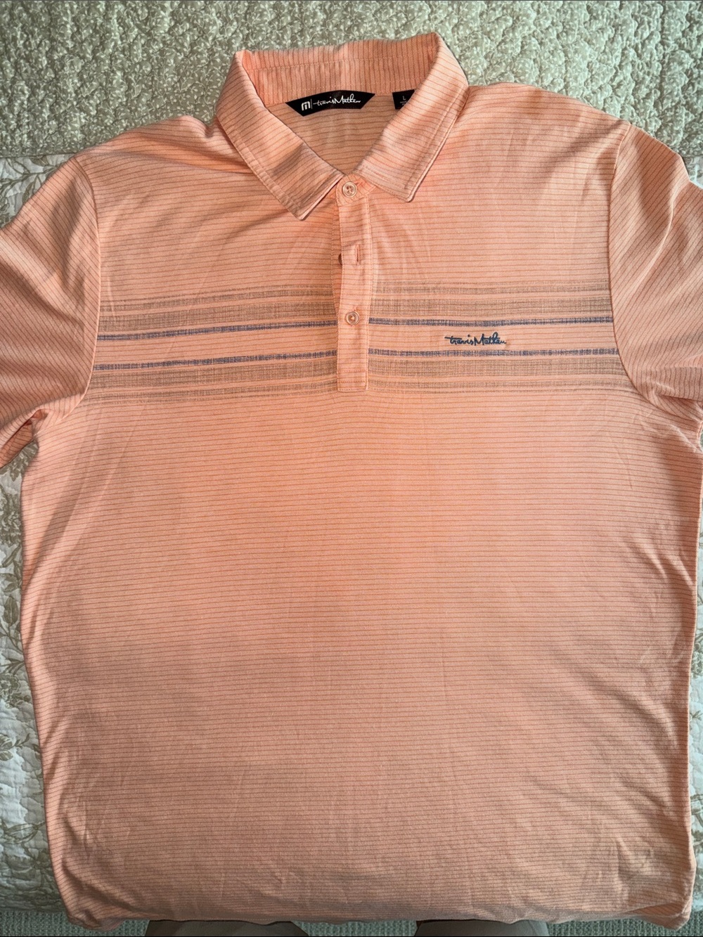 Travis Mathew Peach Polo with Subtle Horizontal Stripe